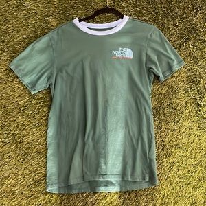 Green north face shirt